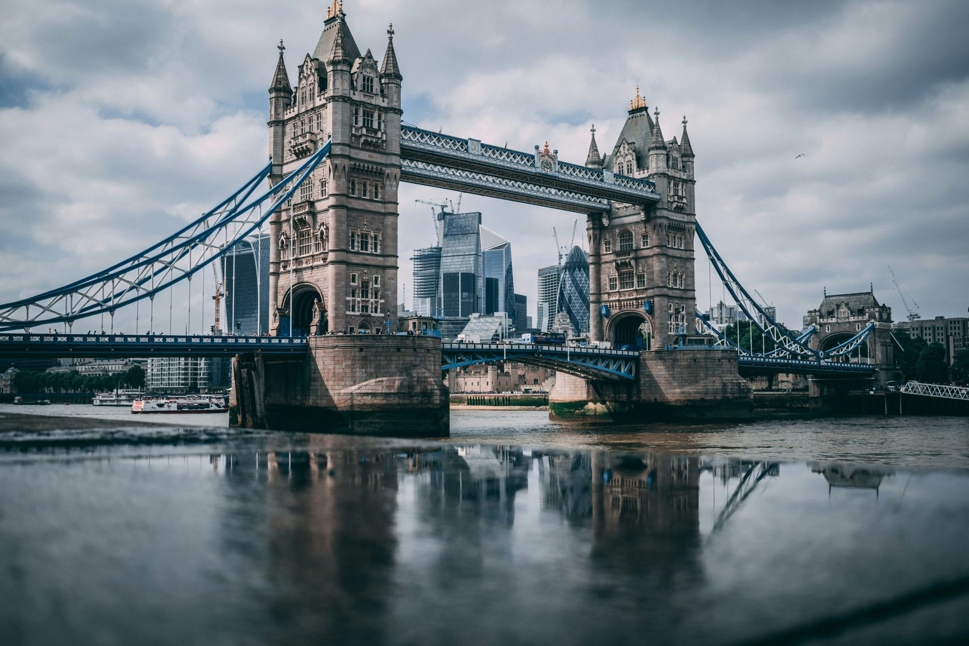 London Tower Bridge taken under white clouds during daytime